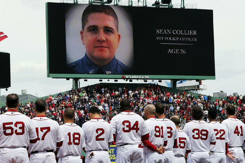 Massachusetts Institute of Technology police officer Sean Collier is remembered Saturday during ceremonies at Boston’s Fenway Park before the game between the Red Sox (shown) and the Kansas City Royals. 