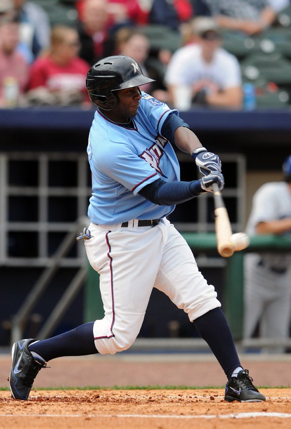 Roman Hernandez of the Northwest Arkansas Naturals gets a hit during Sunday’s game at Arvest Ballpark in Springdale against Tulsa. 