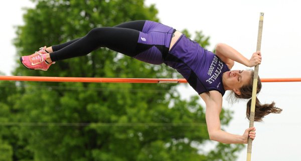 Sara Calhoun of Fayetteville High School clears 9-feet-6-inches in the pole vault April 12 during the Joe Roberts Relays at Southwest Junior High School in Springdale. 