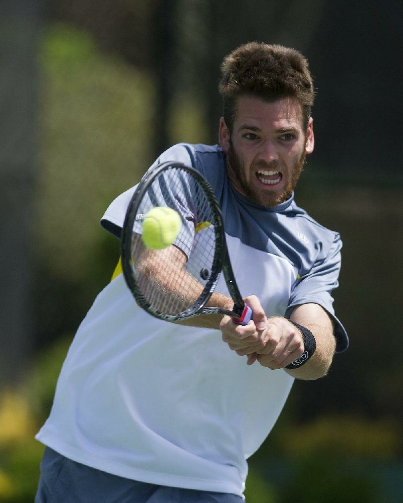 Austin Krajicek returns a volley during the USTA St. Vincent de Paul men’s singles championship match Sunday. 