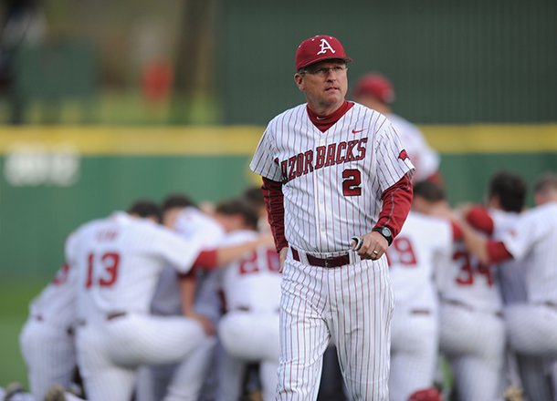 Arkansas coach Dave Van Horn walks to the dugout Saturday, April 20, 2013, before the start of play against Texas A&M at Baum Stadium in Fayetteville.