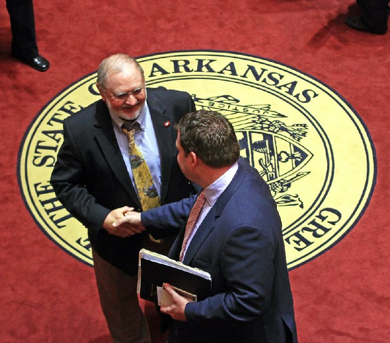 State Senators David Wyatt, D-Batesville, says good bye to Michael Lamoureux, R-Russellville, after ending the 100-day legislative session on Tuesday which had Republicans in control of the House and Senate for the first time since Reconstruction. 
