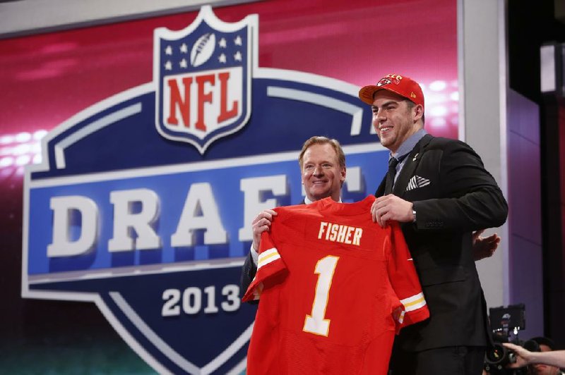 Central Michigan offensive lineman Eric Fisher stands next to NFL Commissioner Roger Goodell after the Kansas City Chiefs on Thursday night made Fisher the top pick in the NFL Draft where five of the first 10 were offensive linemen. Fisher, a 6-7, 306-pound offensive tackle, was the first player from the Mid-American Conference was selected as the first choice in the draft. Tavon Austin, a West Virginia wide receiver, was the first skill player chosen, going eighth to St. Louis. 