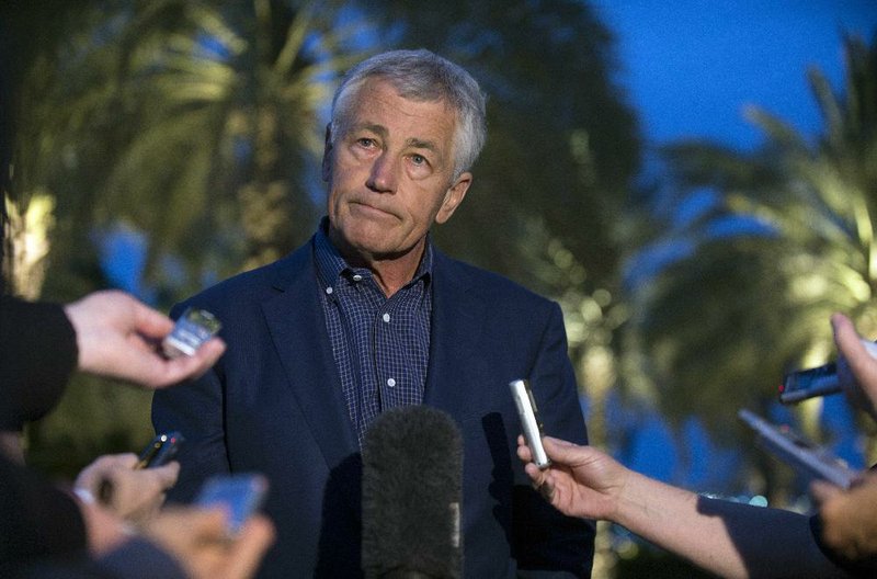 U.S. Secretary of Defense Chuck Hagel speaks with reporters Thursday in Abu Dhabi, United Arab Emirates, after reading a statement on the use of chemical weapons in the Syrian conflict. 
