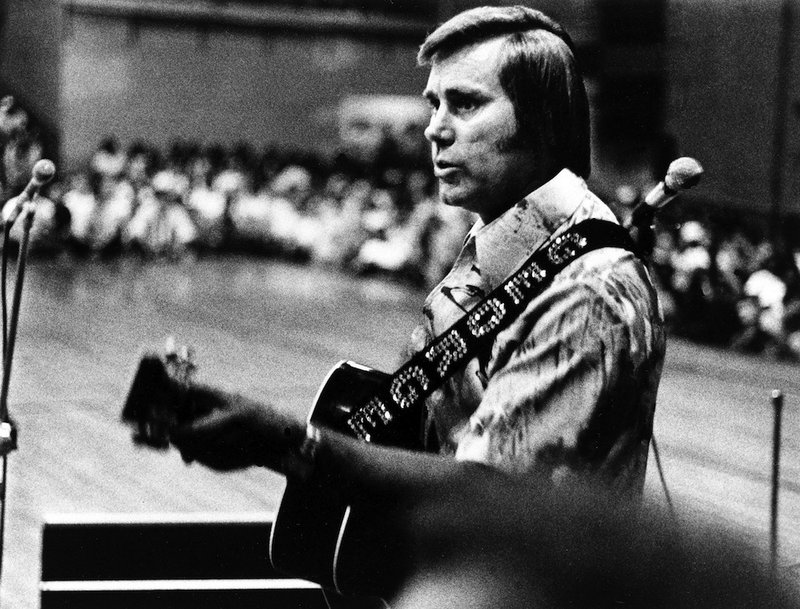 FILE - In this undated photo, Country singer George Jones is shown performing with his guitar. Jones, the peerless, hard-living country singer who recorded dozens of hits about good times and regrets and peaked with the heartbreaking classic "He Stopped Loving Her Today," has died. He was 81. Jones died Friday, April 26, 2013 at Vanderbilt University Medical Center in Nashville after being hospitalized with fever and irregular blood pressure, according to his publicist Kirt Webster.