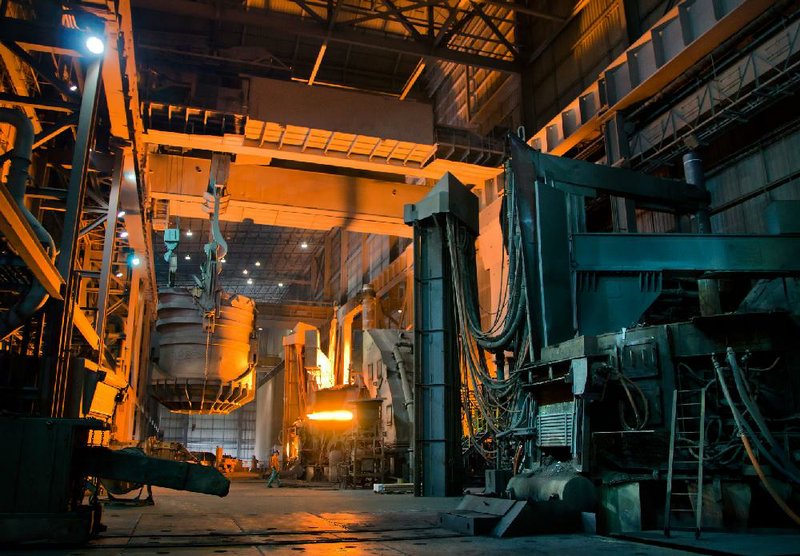 A 3,000-degree Fahrenheit electric arc furnace prepares to receive a "charge" of scrap metal for conversion into steel Saturday at Severstal Columbus. Employees' families got an inside glimpse of the entire metallurgical process during an open house and tour of the plant's one million square foot facilities Saturday during "Family Day." (Photo by Carmen K. Sisson/Dispatch Staff)