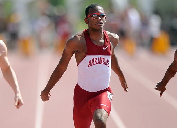 Arkansas sprinter Akheem Gauntlett crosses the finish line during a March 31, 2012 race at John McDonnell Field in Fayetteville. 