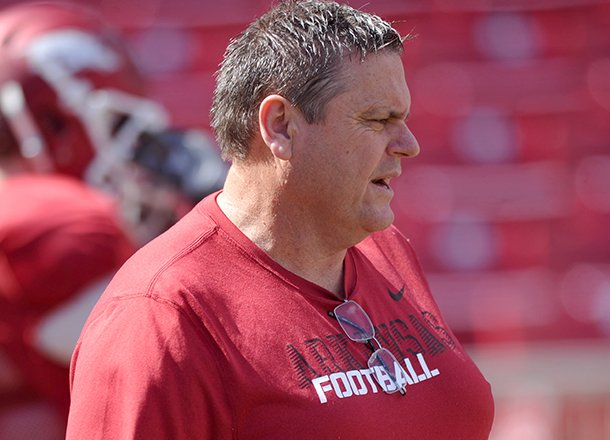 Arkansas offensive line coach Sam Pittman works with the Razorbacks during an April 6, 2013 practice at Donald W. Reynolds Razorback Stadium. 