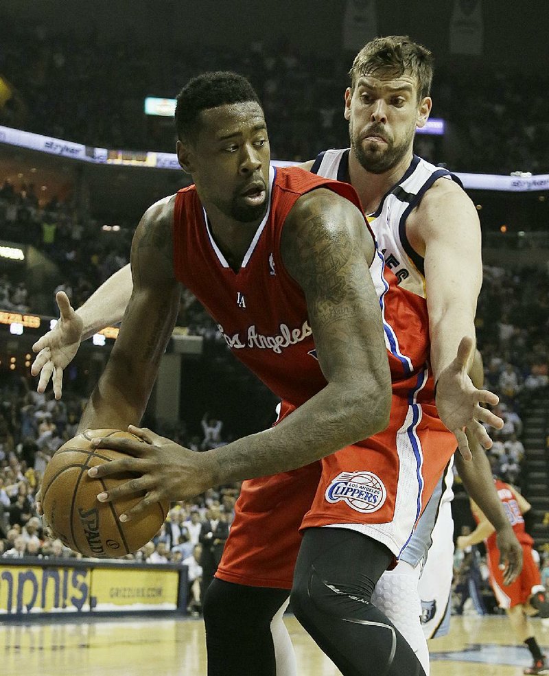 Memphis Grizzlies' Marc Gasol, of Spain, back, defends against Los Angeles Clippers' DeAndre Jordan during the second half of Game 3 in a first-round NBA basketball playoff series, in Memphis, Tenn., Thursday, April 25, 2013. The Grizzlies defeated the Clippers 94-82. (AP Photo/Danny Johnston)