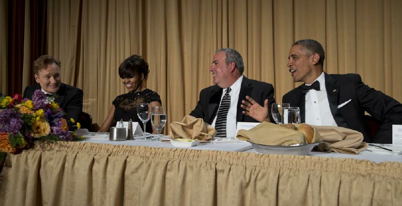 Late-night television host Conan O'Brien, from left, first lady Michelle Obama, Michael Clemente, Executive Vice President of Fox News, and President Barack Obama attend the White House Correspondents' Association Dinner at the Washington Hilton Hotel, Saturday, April 27, 2013, in Washington.  (AP Photo/Carolyn Kaster)