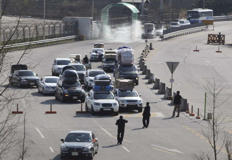 South Korean vehicles carrying products from North Korea’s Kaesong industrial complex arrive at the customs, immigration and quarantine office near the border village of Panmunjom in Paju, South Korea, on Saturday. 