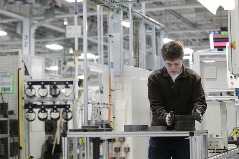 FILE - In this Thursday, Feb. 28, 2013, file  photo, Jordan Kenyon works on the assembly line during a media tour before an investment and jobs announcement event at the Chrysler transmission plant in Kokomo, Ind. Chrysler reports quarterly earnings on Monday, April 29, 2013. (AP Photo/AJ Mast)