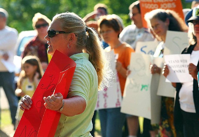 Mayflower resident Angela Harness speaks during a gathering by a group called Arkansans Concerned about Oil Pipelines  Monday afternoon at Pearce Park in Mayflower. The group spoke of concerns about pipelines on the one month anniversary of an oil spill in Mayflower from an ExxonMobil pipeline.