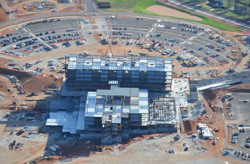 Special to the Democrat-Gazette/MERCY JOPLIN...The construction on Mercy Hospital in Joplin, Mo., is shown in this April 19 aerial photo. In the wake of the EF-5 tornado that hit St. John's Hospital, as it was then known, in Joplin, hospital organizers decided to enlist contractors and builders from around the country to help them construct a hospital that can withstand both a tornado and an earthquake. The new hospital is expected to open in 2015.