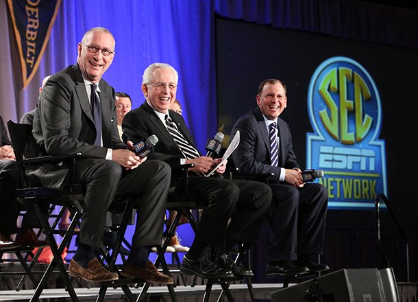 ESPN president John Skipper, left, SEC commissioner Mike Slive, center, and ESPN Senior Vice President of Programing Justin Connolly, right, answer questions from the media during a news conference announcing the launching of the Southeastern Conference Network in partnership with ESPN, Thursday, May 2, 2013, in Atlanta. The network will produce 1,000 live events each year, including 450 televised on the network and 550 distributed digitally. (AP Photo/Atlanta Journal-Constitution, Jason Getz)