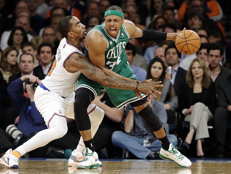 Boston Celtics forward Paul Pierce (right) tries to dribble past New York Knicks guard J.R. Smith during the Celtics’ 92-86 victory on Wednesday night. Pierce scored 19 points as the Celtics cut the Knicks’ lead in the best-of-7 series to 3-2. 