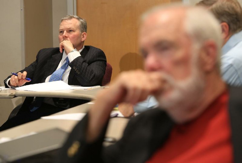 U.S. Rep. Tim Griffin, R-Ark., (left) and Pulaski County Judge Buddy Villines listen to Graham Rich, chief executive officer of Central Arkansas Water, answer questions Thursday afternoon about the Pegasus pipeline that runs through the Lake Maumelle watershed. 