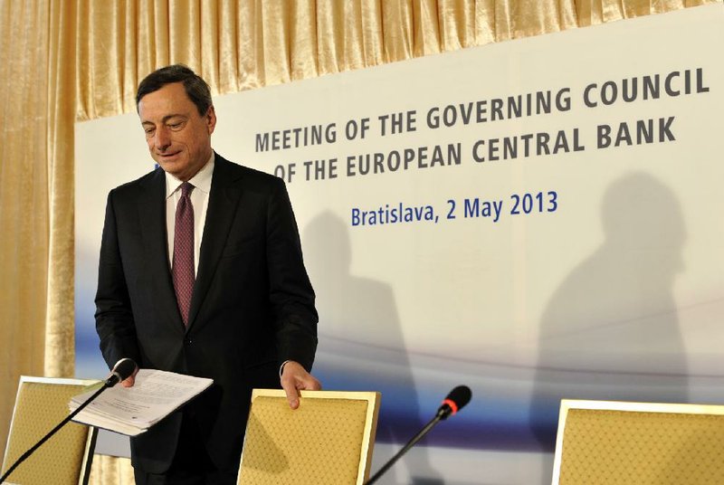 European Central Bank President Mario Draghi arrives for a news conference Thursday in Bratislava, Slovakia, after the bank cut its key interest rate to 0.50 percent. 