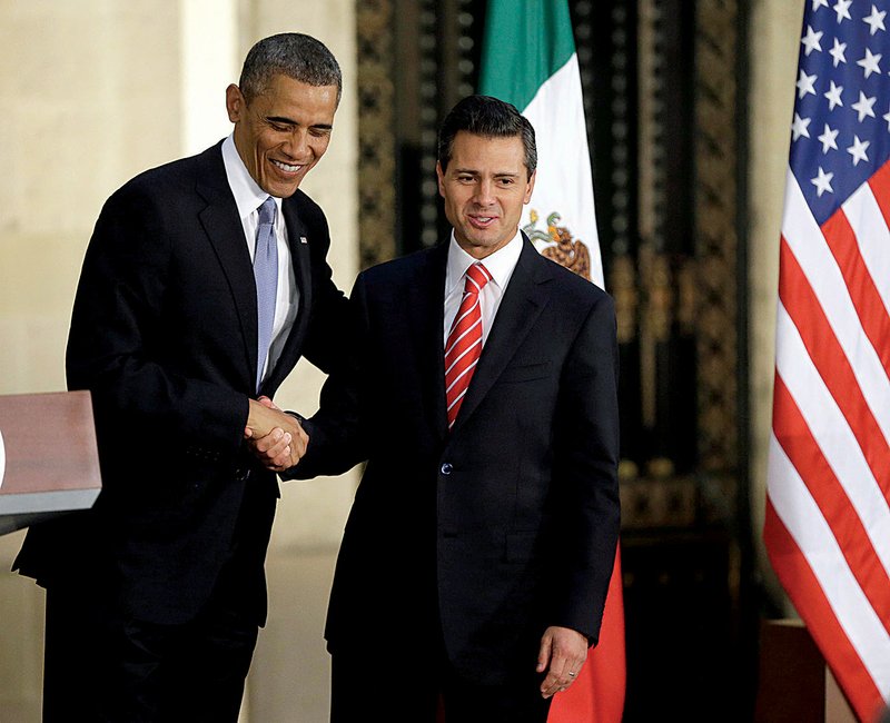 President Barack Obama (left) and Mexican President Enrique Pena Nieto finish their news conference Thursday at the National Palace in Mexico City. Obama recommitted the U.S. to cooperate with Mexico in the war on illegal drugs. 