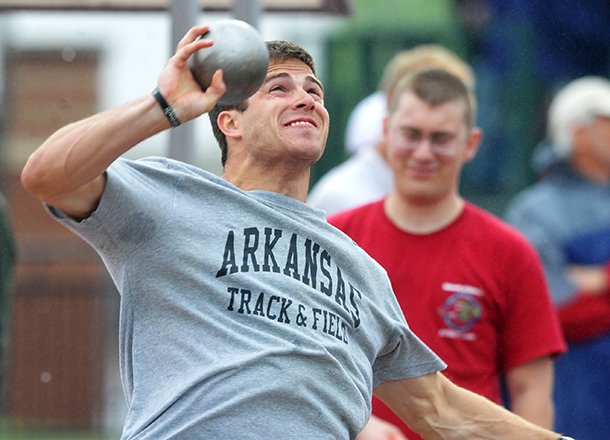 Kevin Lazas launches the shot put as he competes in the decathlon during the Arkansas Team Invitational on April 27, 2013 at John McDonnell Field in Fayetteville. 