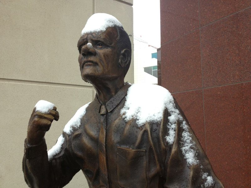 Snow on the Frank Broyles statue in Fayetteville on May 3, 2013.