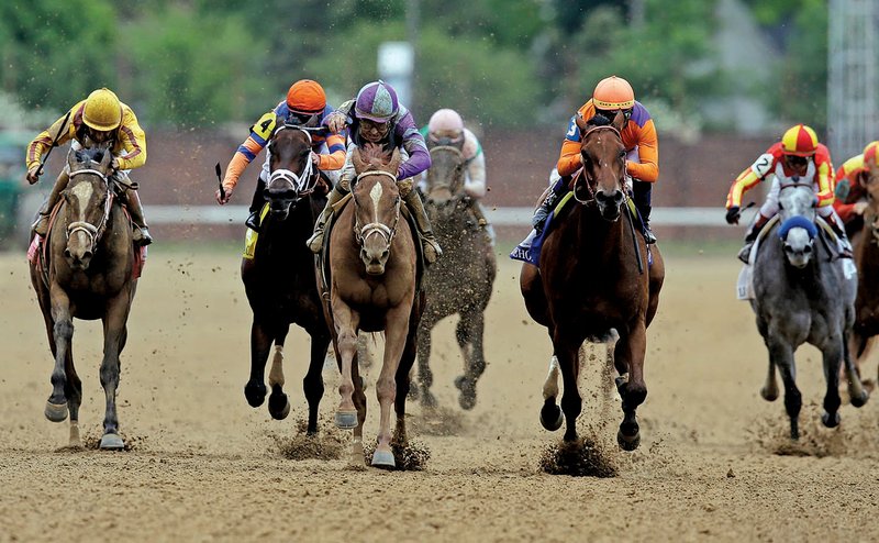 Jockey Mike Smith rides Princess of Sylmar (third from left) to a half-length victory in the Kentucky Oaks on Friday at Churchill Downs in Louisville, Ky. Princess of Sylmar was one of four fi llies in the race trained by Todd Pletcher. 