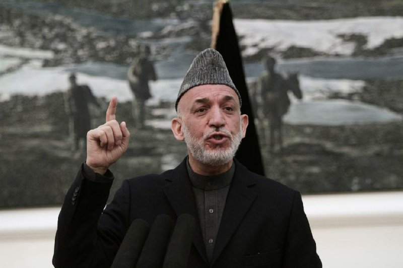 Afghan President Hamid Karzai speaks during a news conference in Kabul, Afghanistan, Saturday, May 4, 2013. Karzai says the director of the CIA assured him that regular funding his government receives from the agency will not be cut off. He says Afghanistan has been receiving such funding for more than 10 years and expressed hope at a Saturday news conference that it will not stop.(AP Photo/Rahmat Gul)