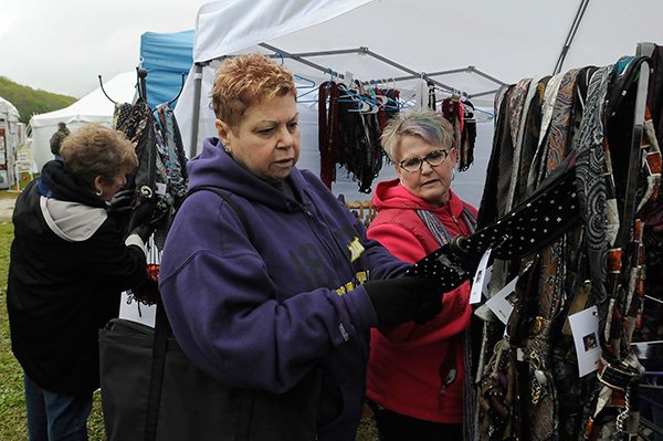 Karen Runestrand of Bella Vista, left, and Minnesota residents Mary K. Weik, center and Pat Lee look at scarves. 