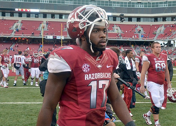 Arkansas quarterback Brandon Mitchell walks off the field following the Razorbacks' 52-0 loss to Alabama on Sept. 15, 2012 at Razorback Stadium in Fayetteville.