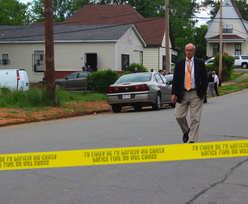 Little Rock Police Department Chief Stuart Thomas walks away from a house where two people were found dead Monday.