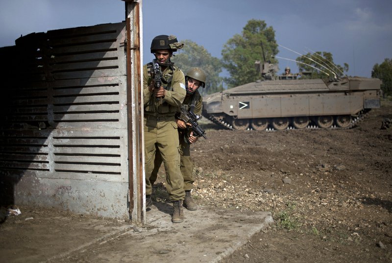 Israeli soldiers of the Golani brigade during an exercise in the Golan Heights on Monday, May 6, 2013. Israel’s weekend airstrike on a military complex near the Syrian capital of Damascus killed dozens of Syrian soldiers, a group of anti-regime activists said Monday, citing information from military hospitals. The Syrian government has not released a death toll, but Syrian state media have reported casualties in Sunday’s pre-dawn airstrike, Israel’s third into Syria so far this year. 