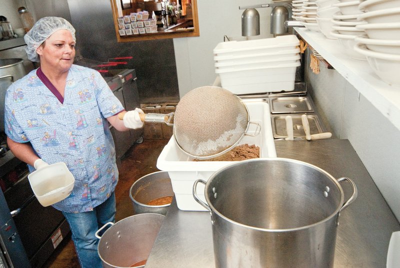 Donna Wallis works in the kitchen at the Tamale Factory in Gregory, preparing ingredients for the tamales made there.  She is also part of the wait staff when the restaurant is open on Fridays and Saturdays.