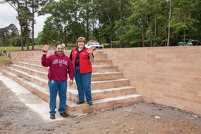 Anthony Bloom, general manager of Sykes, and Brenda Weldon from Summit Bank are shown at the new stage being built for the 33rd  Brickfest in Malvern. The annual festival is expected to attact more people and provide more entertainment with the permanent, state-of-the-art outdoor stage at Malvern City Park.