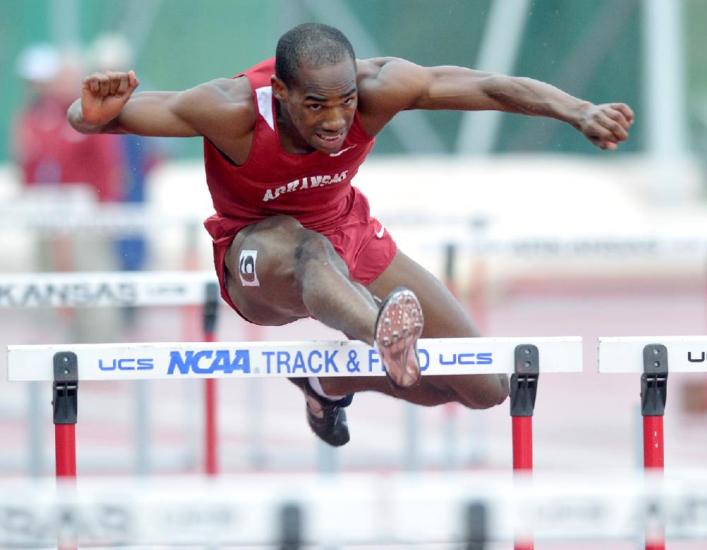 NWA Media/MICHAEL WOODS  --04/27/2013--   University of Arkansas hurdler Caleb Cross clears a hurdle in the mens 100 meter hurdles during Saturday afternoons Arkansas Team Invitational at John McDonnell Field in Fayetteville.
