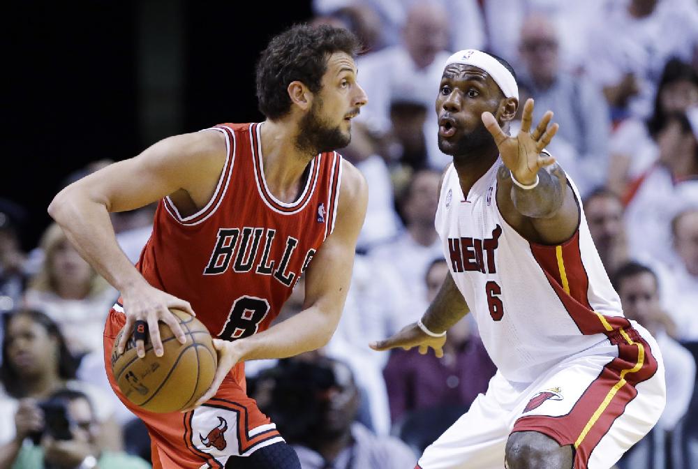 Chicago Bulls guard Marco Belinelli (8), of Italy, looks for an open teammate past Miami Heat forward LeBron James (6) during the first half of Game 2 of their NBA basketball playoff series in the Eastern Conference semifinals, Wednesday, May 8, 2013, in Miami. (AP Photo/Lynne Sladky)