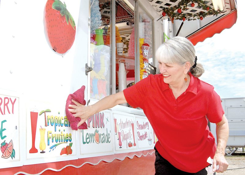 Linda Valliere cleans the outside of her concession stand at a previous Yell Fest. The 2013 Yell Fest will be Friday and Saturday in Dardanelle.