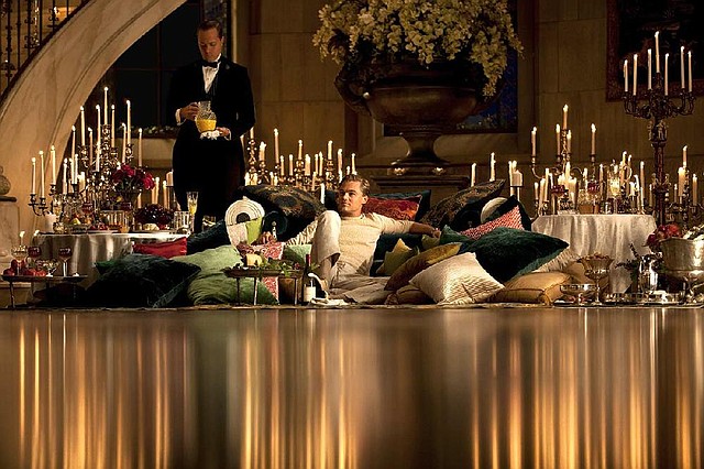 Attended by his butler (Conor Fogarty), the mysterious Jay Gatsby (Leonardo DiCaprio) lolls in luxury in Baz Luhrmann’s The Great Gatsby. 