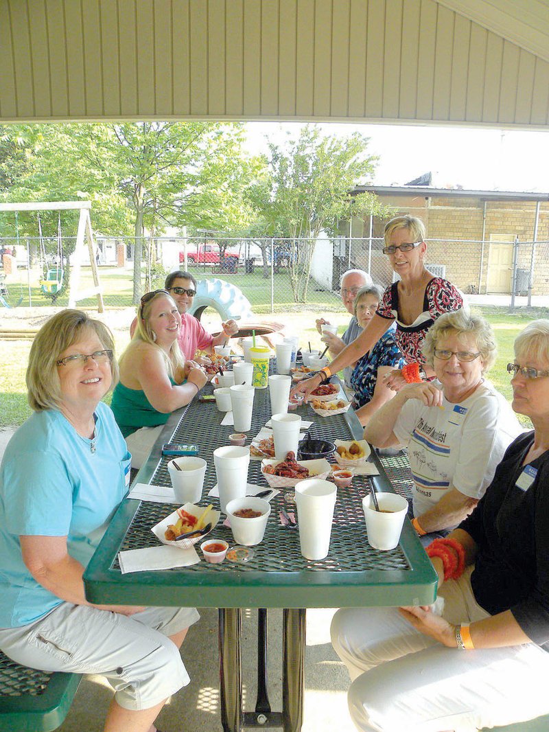 From the left, Carolyn James, Teran Steele, Nate Steele, McCrory Mayor Doyle Fowler and his wife, Earline, Christie Curbo and Peggy Rooks eat crawfish at Mosquitofest 2012. This year’s festival will kick off Wednesday. 