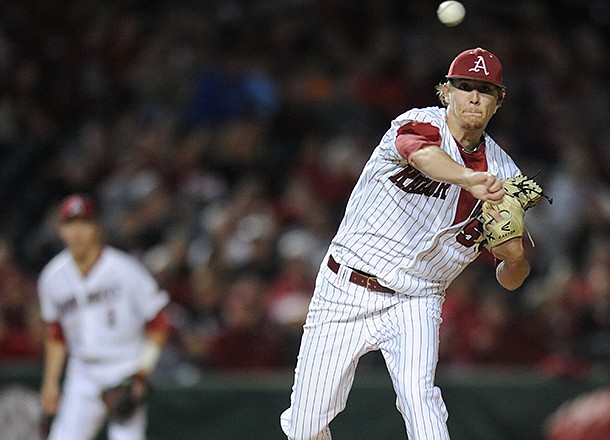 Arkansas starter Ryne Stanek throws to first base Saturday, April 20, 2013, during the third inning of play against Texas A&M at Baum Stadium in Fayetteville.