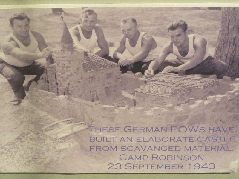 A Camp Robinson photograph from 1943 shows German prisoners of war with a castle they’d built for fun from scrap material. 