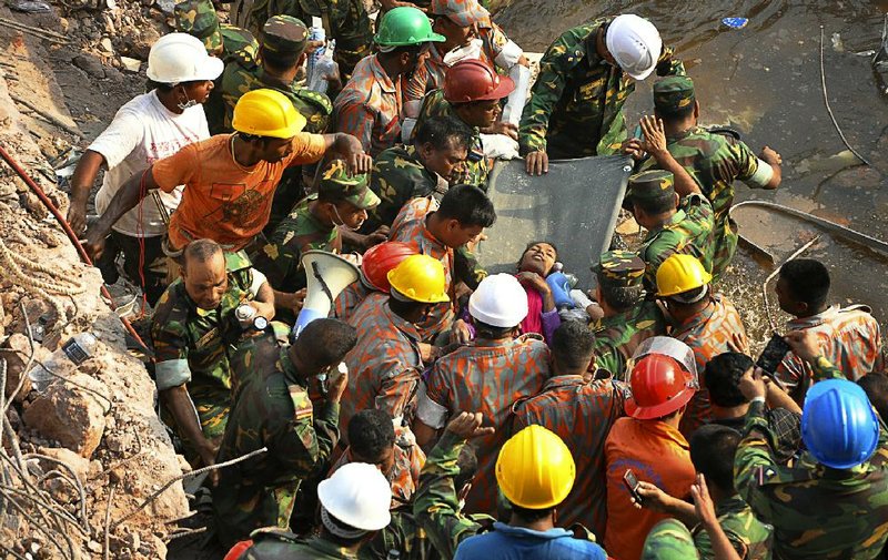 Cries of “Save me” drew rescuers Friday to Reshma Begum, who had been under the rubble of a factory building that collapsed April 24. 