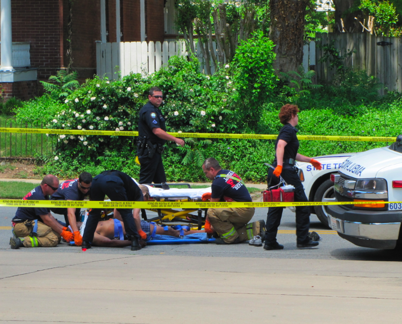 Emergency responders treat a man after responding to a report of a shooting Saturday in Little Rock.