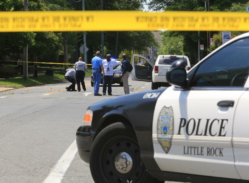 Little Rock police investigate a shooting at Sixth Street near Ferry Street that stemmed from what officers called a road-rage altercation that began on Interstate 30 early Saturday afternoon. 