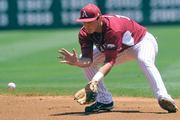 Arkansas second baseman Jordan Farris makes the play on a ground ball for an out in the second inning Sunday against Tennessee at Baum Stadium in Fayetteville. Offensively, Farris recorded four RBIs in the Razorbacks' series-clinching 10-2 win.