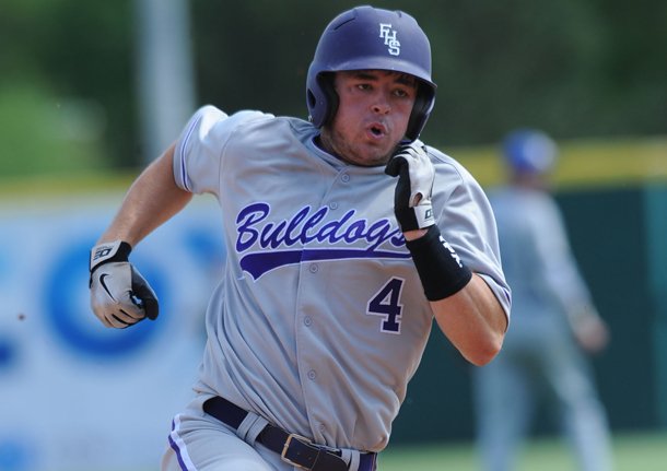 Fayetteville sophomore Drew Tyler heads to third base during the Class 7A state championship game at Baum Stadium. Fayetteville beat Rogers 6-3.