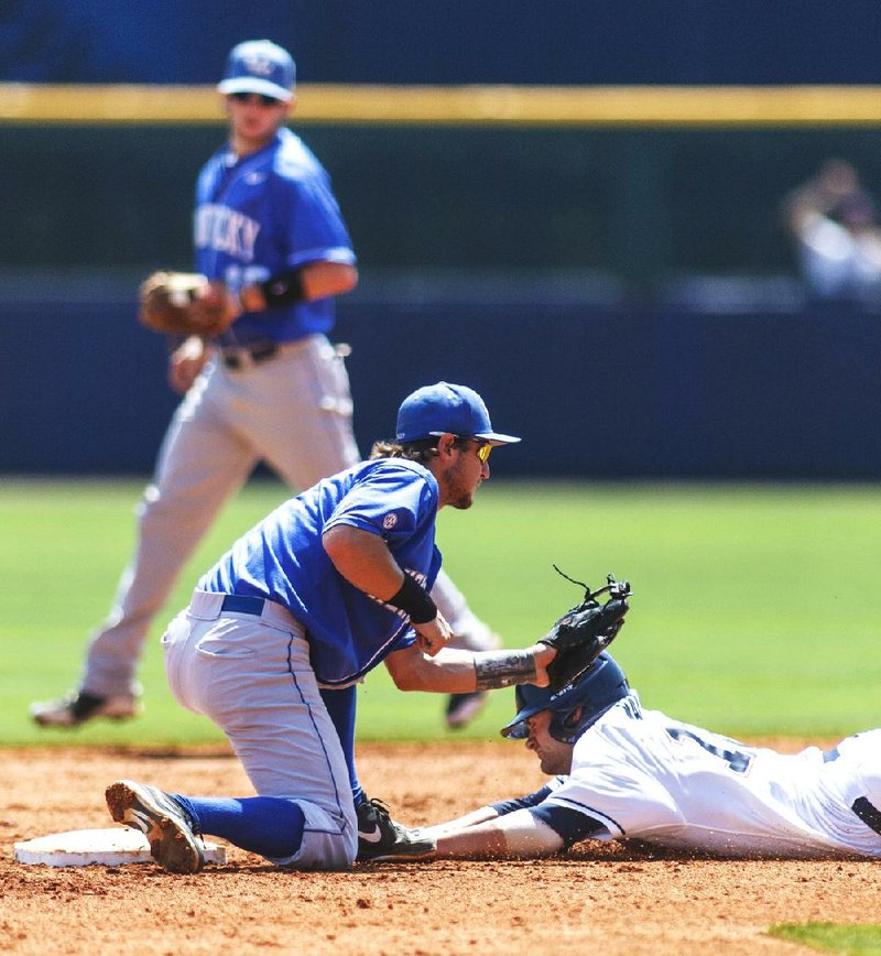 Kentucky's Matt Reida tags out Mississippi's Tanner Mathis on a throw during the Southeastern Conference NCAA college baseball tournament in Hoover, Ala., Tuesday, May 21, 2013. (AP Photo/AL.com, Vasha Hunt) MAGAZINES OUT