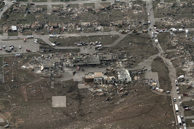 This aerial photo shows damage to Plaza Towers Elementary School after it was hit by a tornado in Moore, Okla., on Monday, May 20, 2013. A tornado roared through the Oklahoma City suburbs Monday, flattening entire neighborhoods, setting buildings on fire and landing a direct blow on an elementary school.