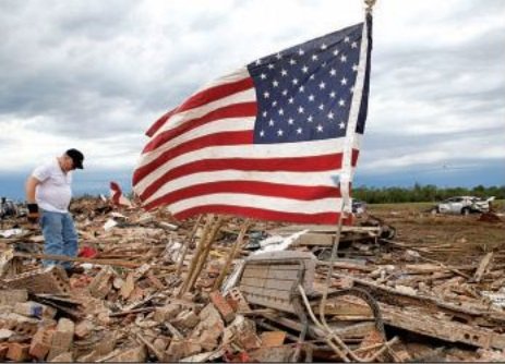 Don Bessinger looks through the remnants of his home Tuesday morning in Moore, Okla., in a hunt for salvageable items. 