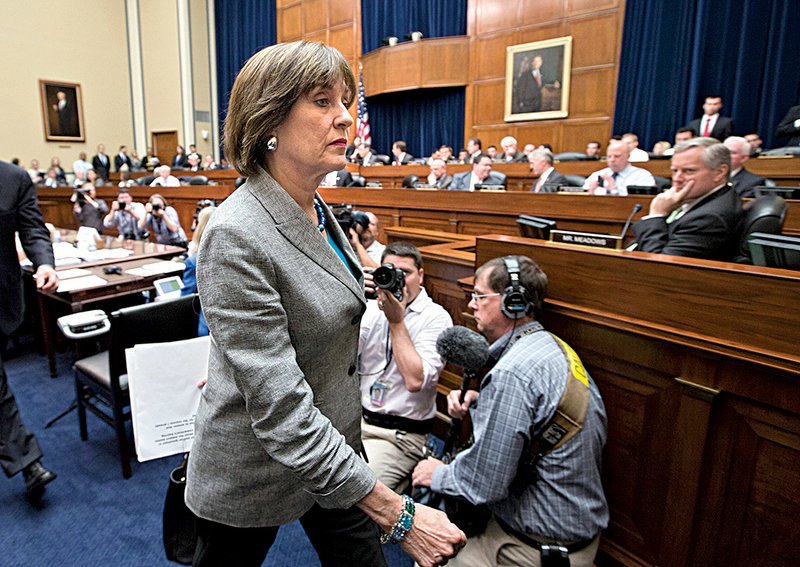 Lois Lerner, who heads the Internal Revenue Service’s division on tax-exempt groups, walks out of a House hearing Wednesday after refusing to answer questions. 
