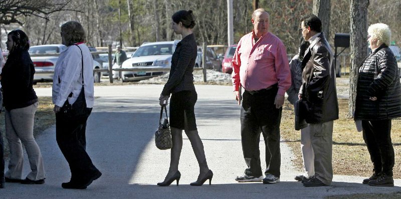 Job seekers line up in April for a career fair in Montpelier, Vt. The number of Americans applying for unemployment benefits last week fell to a seasonally adjusted 340,000, the Labor Department said Thursday. 